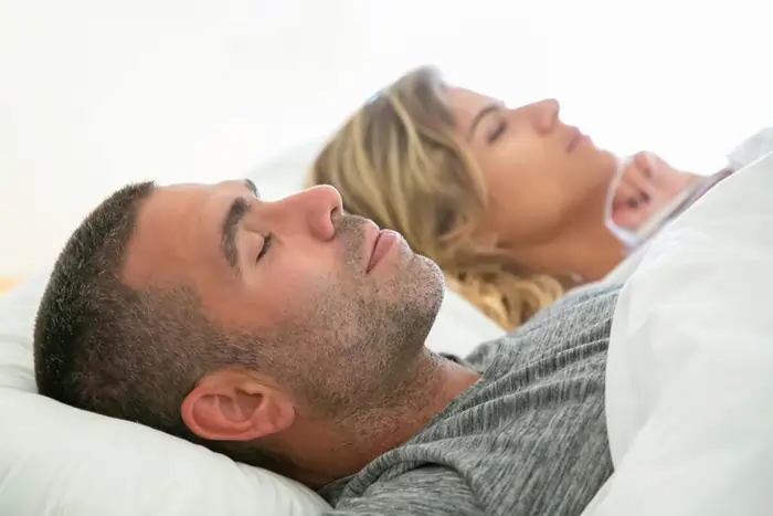 Middle-aged couple implementing healthy sleep habits after 40